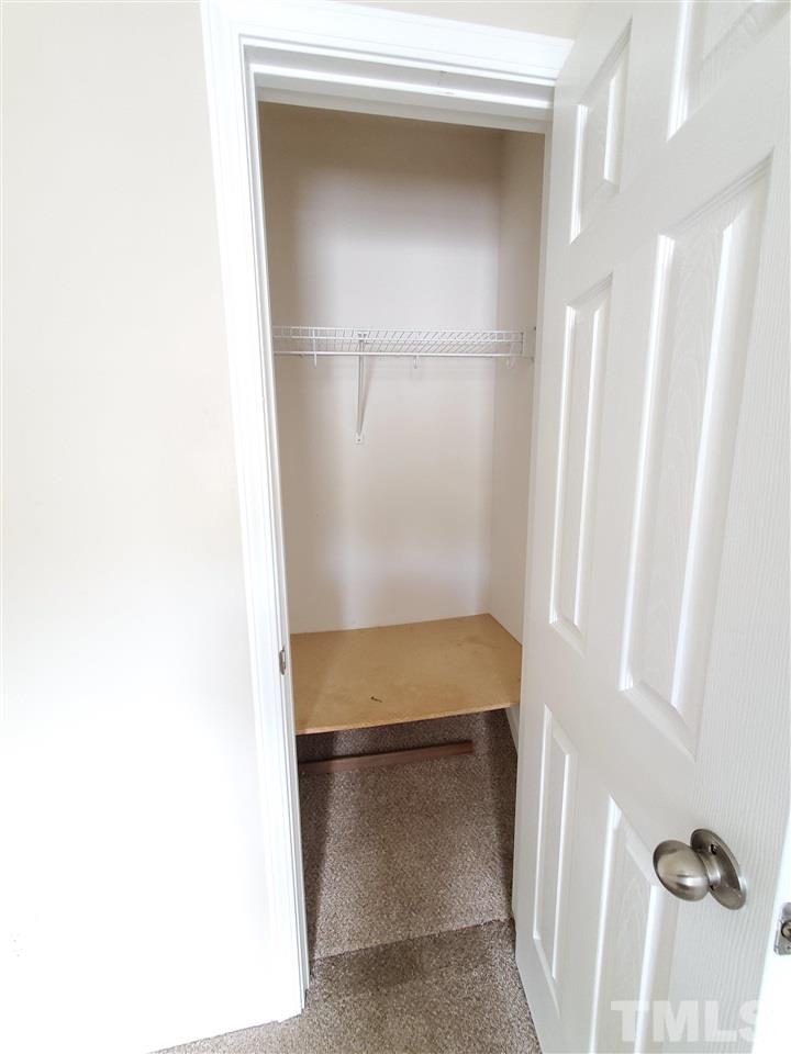 8208 Clasara Circle Raleigh, NC 27613 - Photo 20 of 26 a view of walk in closet with cabinet