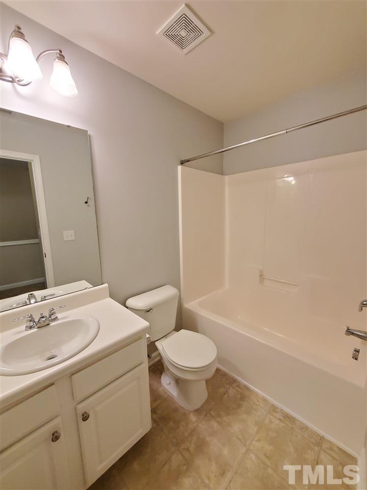 8208 Clasara Circle Raleigh, NC 27613 - Photo 21 of 26 a bathroom with a sink toilet and shower