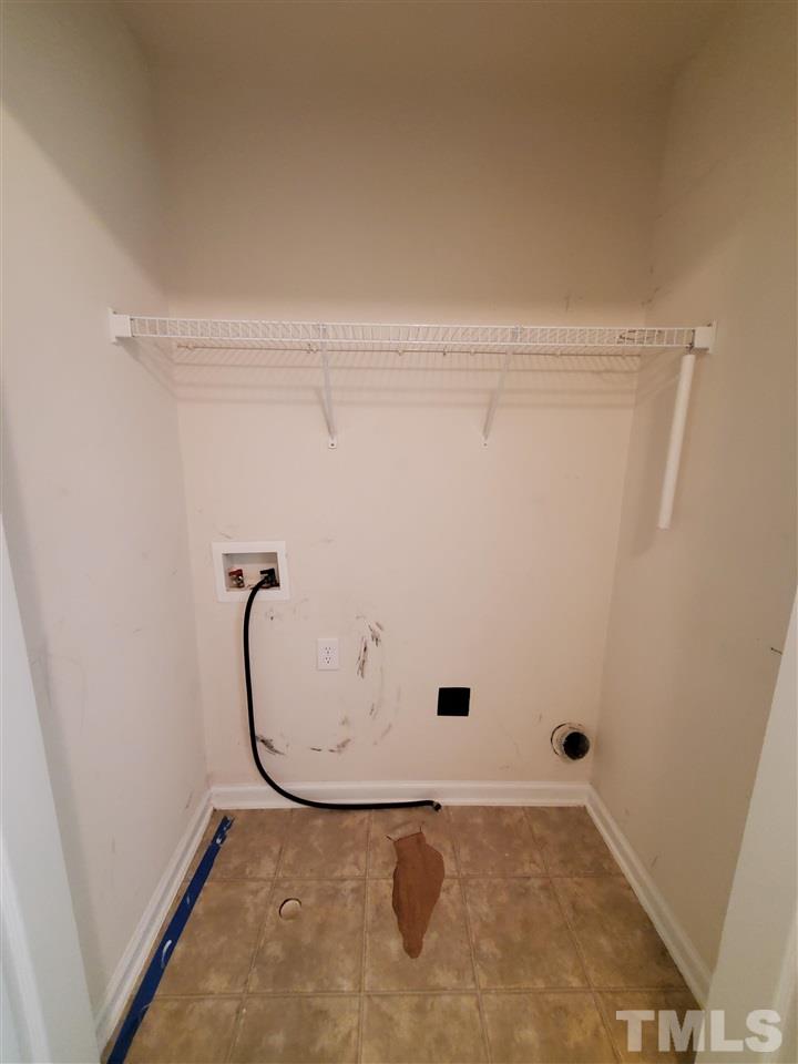 8208 Clasara Circle Raleigh, NC 27613 - Photo 23 of 26 a view of a room with racks on the wall