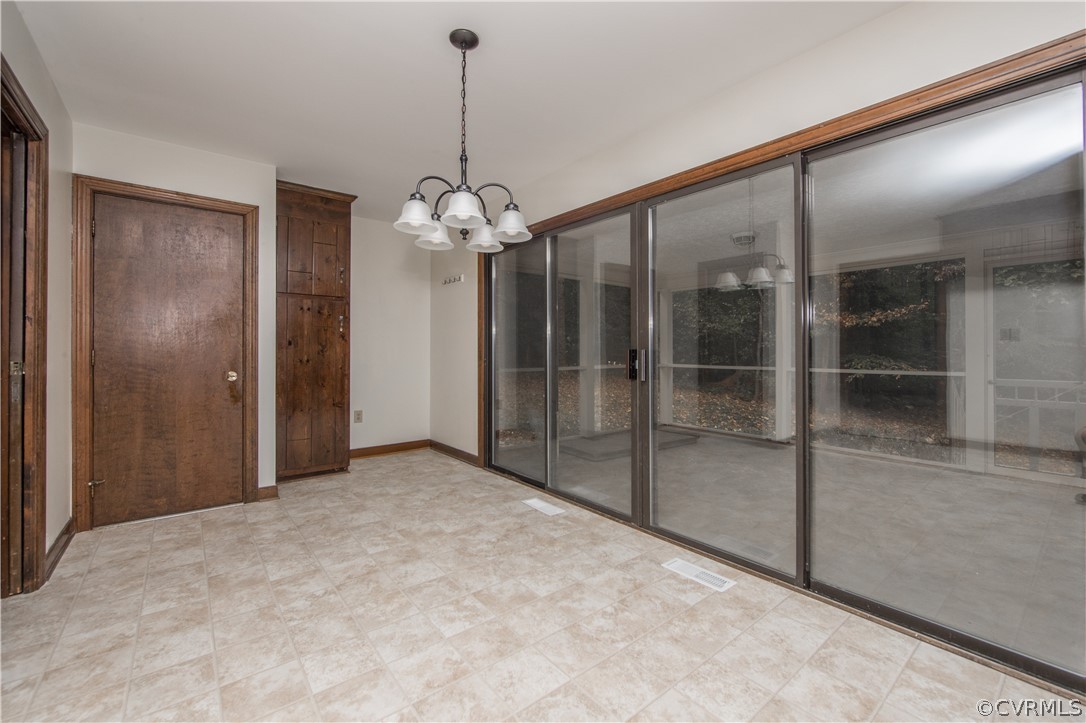 6400 Qualla Road Chesterfield, VA 23832 - Photo 15 of 36 a view of a hallway with a chandelier