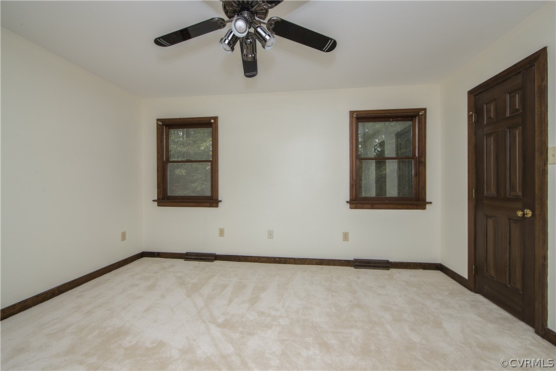6400 Qualla Road Chesterfield, VA 23832 - Photo 20 of 36 an empty room with a window and a ceiling fan