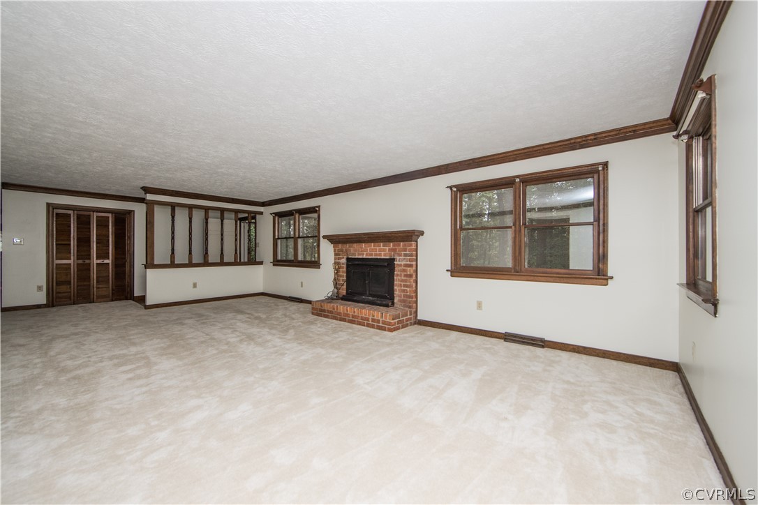 6400 Qualla Road Chesterfield, VA 23832 - Photo 5 of 36 an empty room with furniture and a fireplace