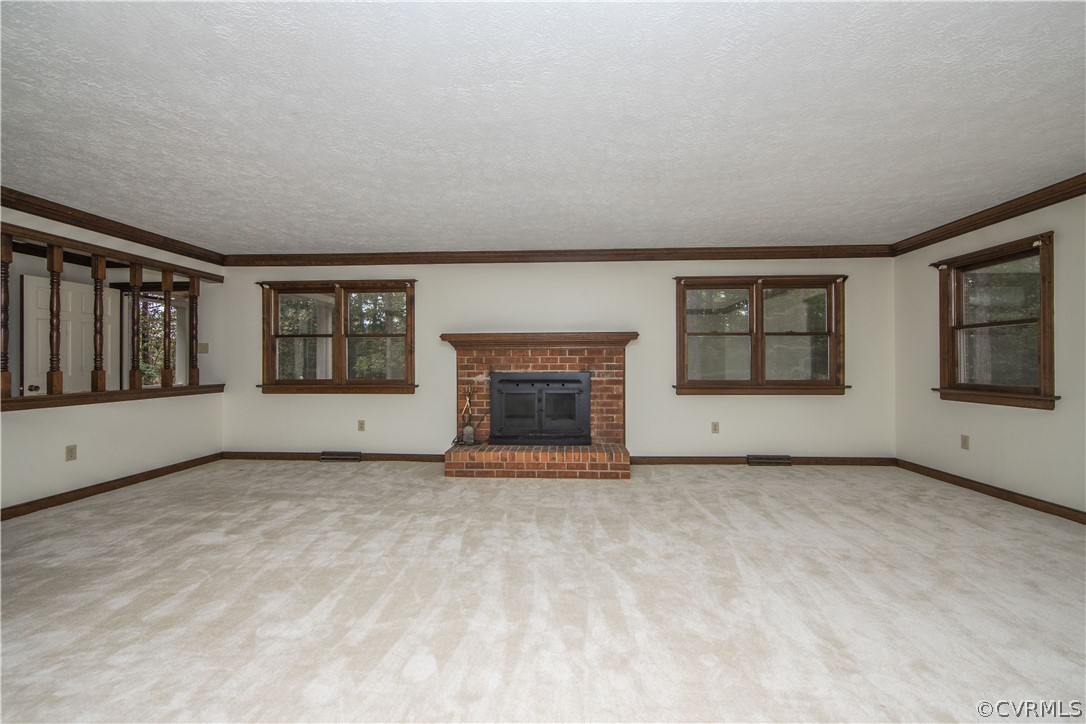 6400 Qualla Road Chesterfield, VA 23832 - Photo 6 of 36 a view of an empty room with a fireplace and a window