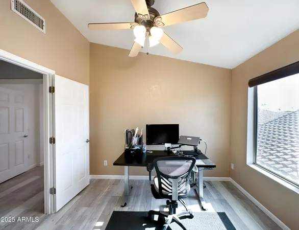 a workspace with furniture and a window