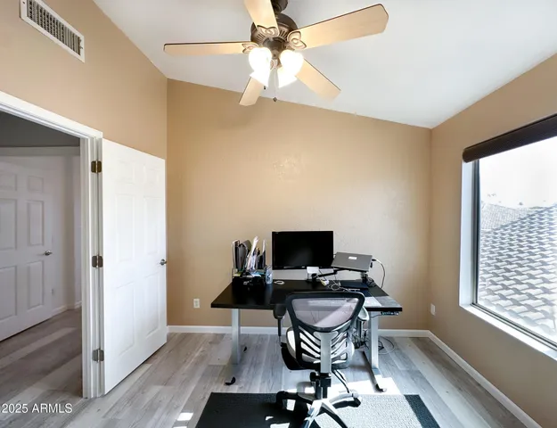 a workspace with furniture and a window