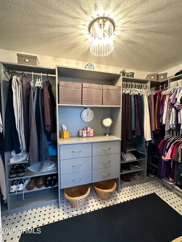 a workspace with white walls and a window