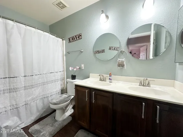a view of a patio with table and chairs potted plants