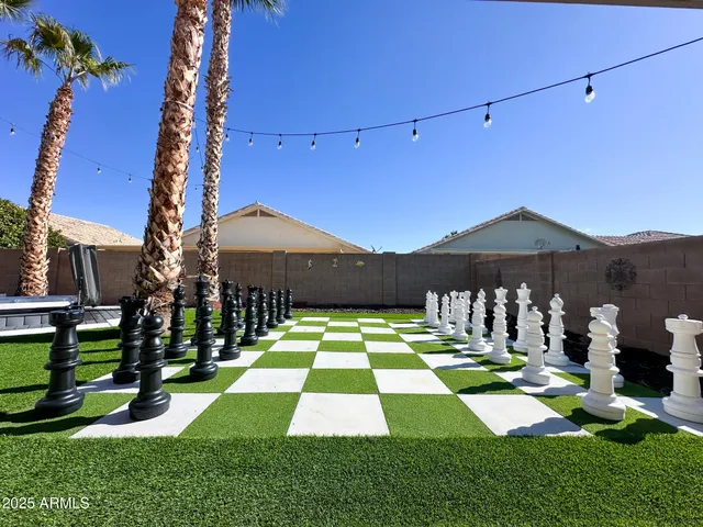 a view of a backyard with sitting area