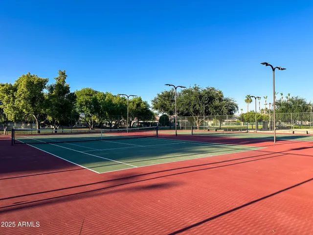 a view of a backyard with sitting area