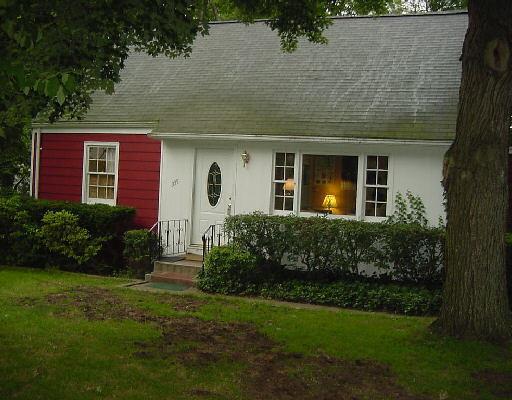 335 Davis Road Fairfield, CT 06825 - Photo 1 of 1 a front view of a house with a yard