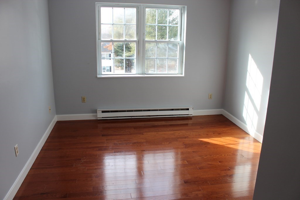 36 C Gibbs Street, Unit 29 Worcester, MA 01607 - Photo 13 of 25 a view of a room with wooden floor and window