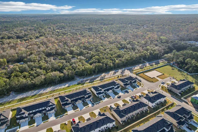 a view of a balcony with two chairs and a stove