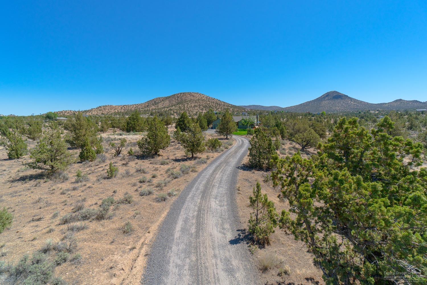 13990 South Sego Lily Road Powell Butte, OR 97753 - Photo 23 of 24 Home sits well back from the street for