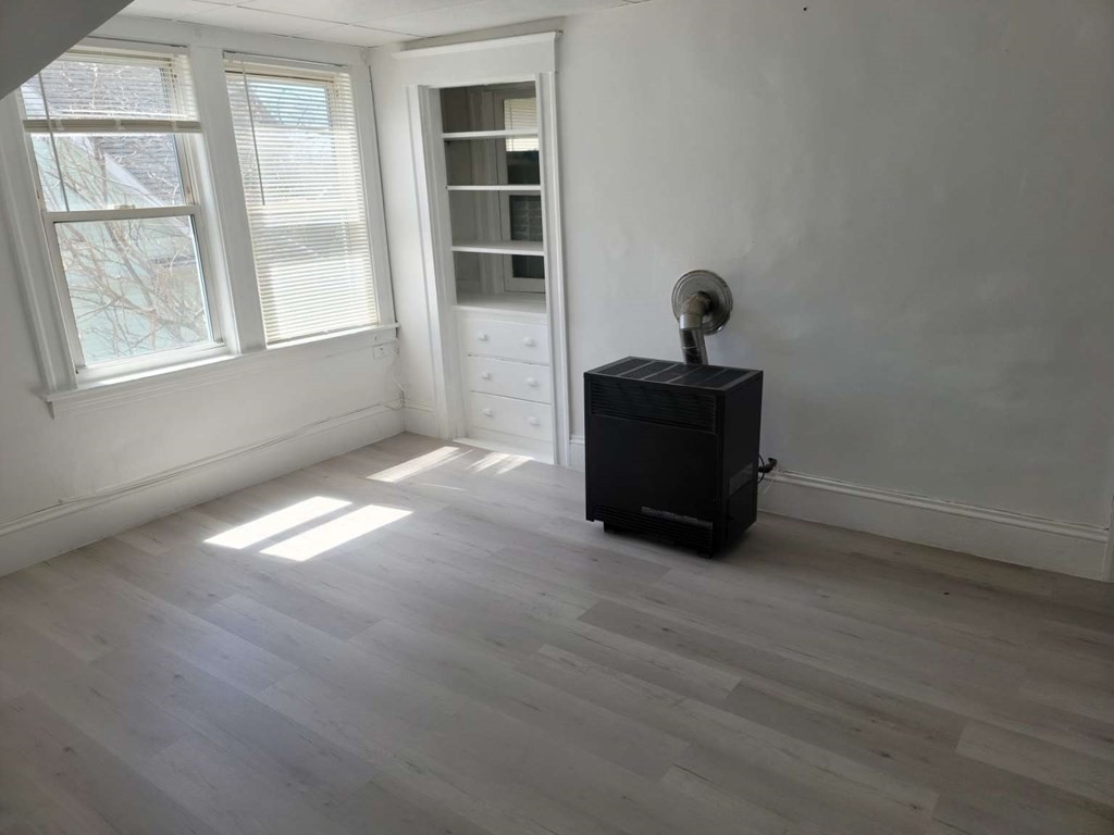 71 Paine Street Worcester, MA 01605 - Photo 18 of 20 a living room with furniture and a window