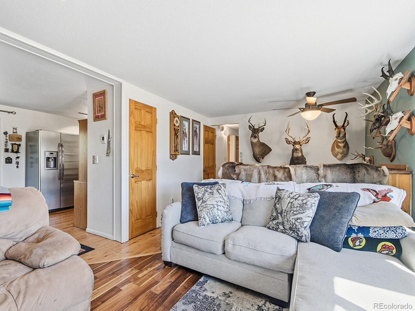 399 Conifer Drive Bailey, CO 80421 - Photo 10 of 42 a living room with furniture and a couch