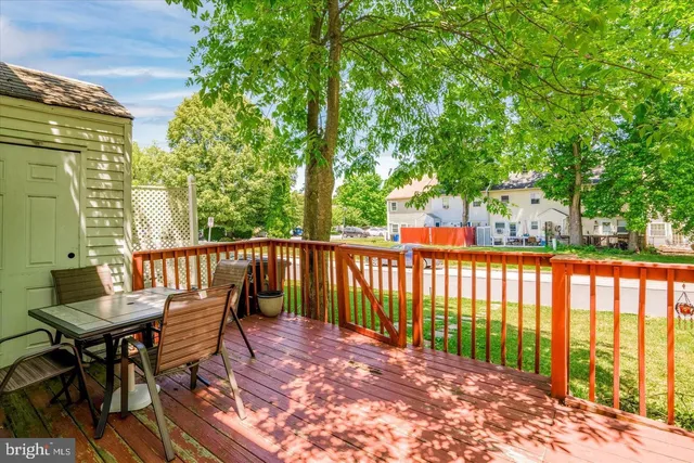 a view of balcony with wooden floor and outdoor seating
