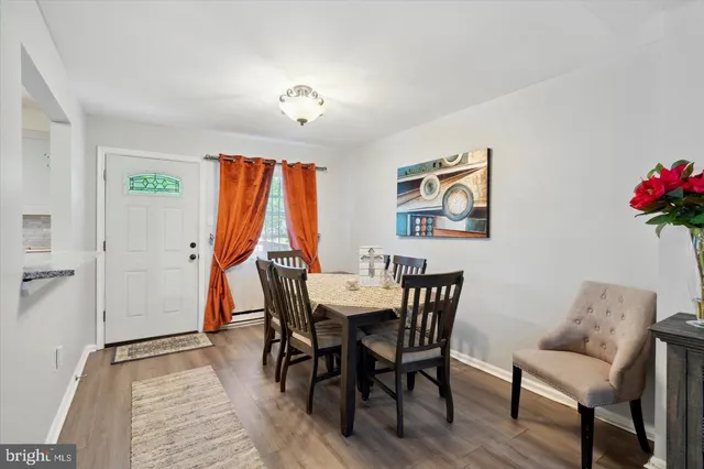 a view of a dining room with furniture and window