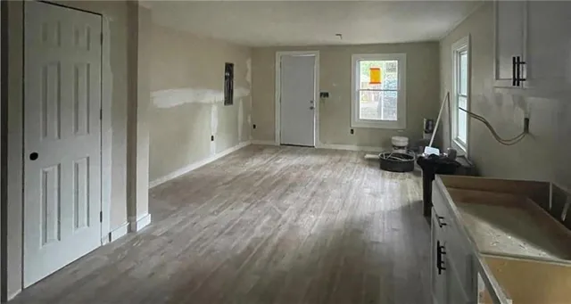 a view of a livingroom with wooden floor