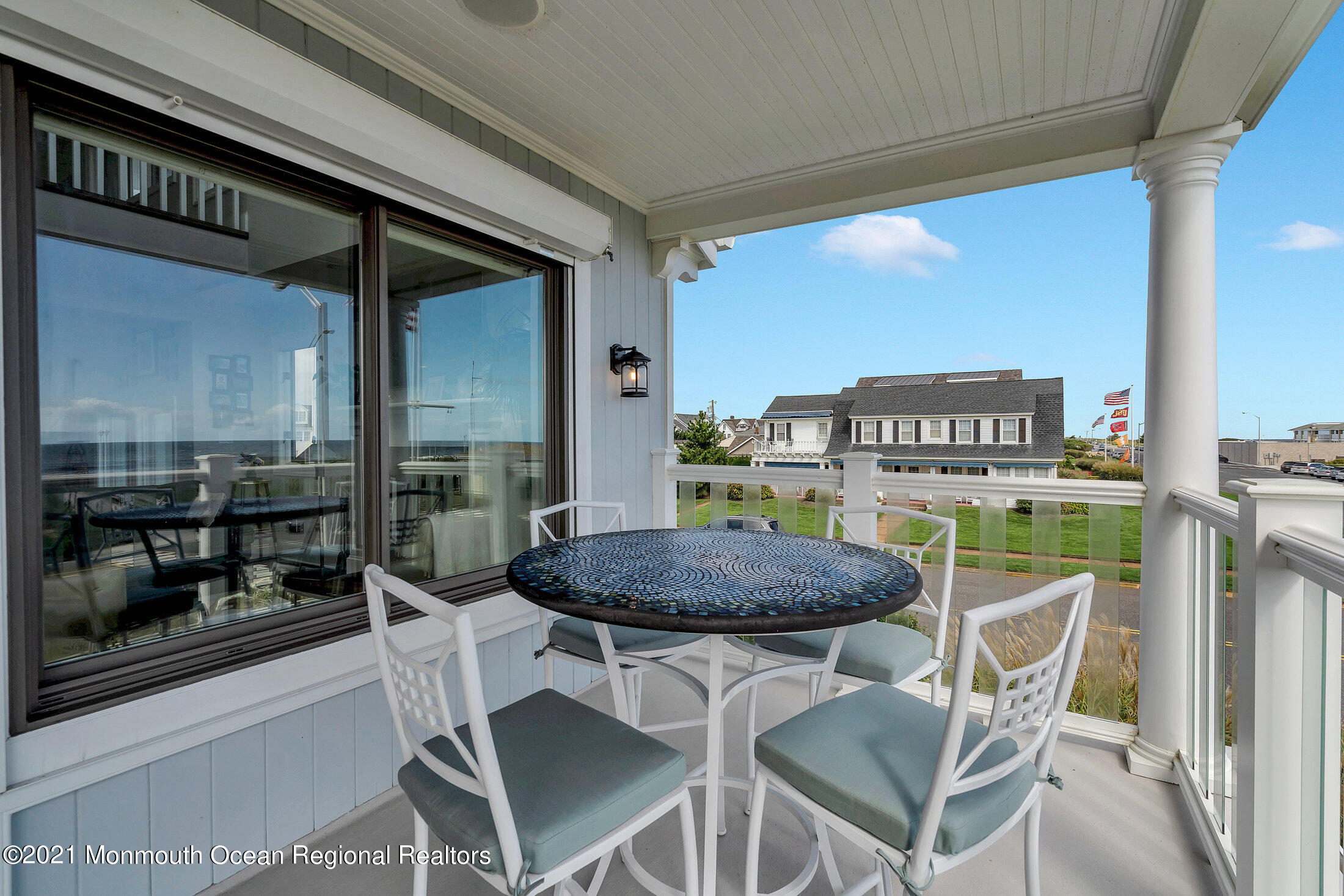 211 North Ocean Avenue Spring Lake, NJ 07762 - Photo 12 of 44 a dining room with furniture and a floor to ceiling window