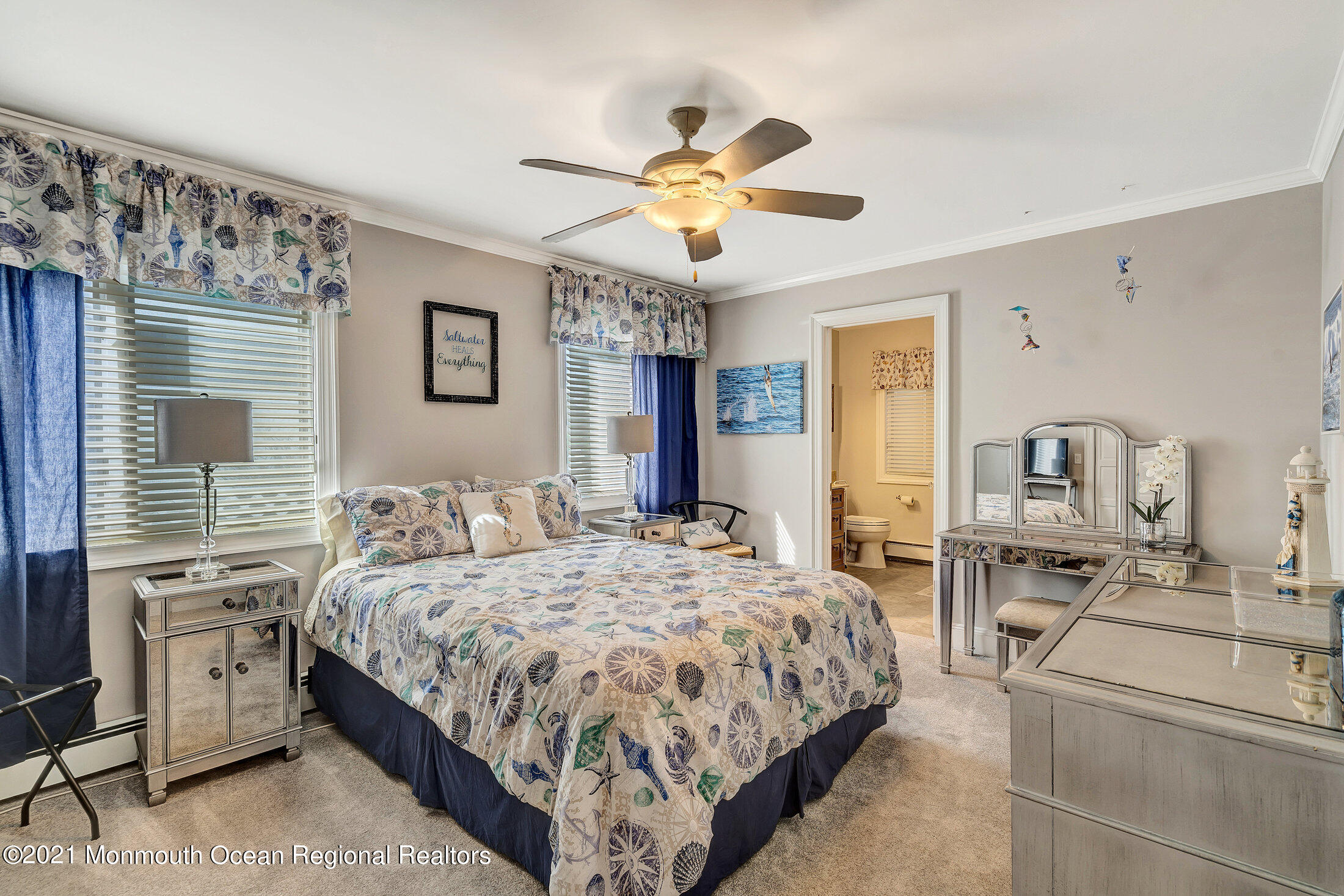 211 North Ocean Avenue Spring Lake, NJ 07762 - Photo 19 of 44 a bedroom with a bed and ceiling fan
