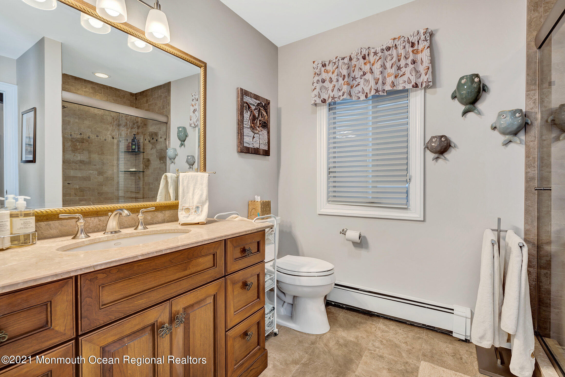 211 North Ocean Avenue Spring Lake, NJ 07762 - Photo 20 of 44 a bathroom with a sink toilet and shower