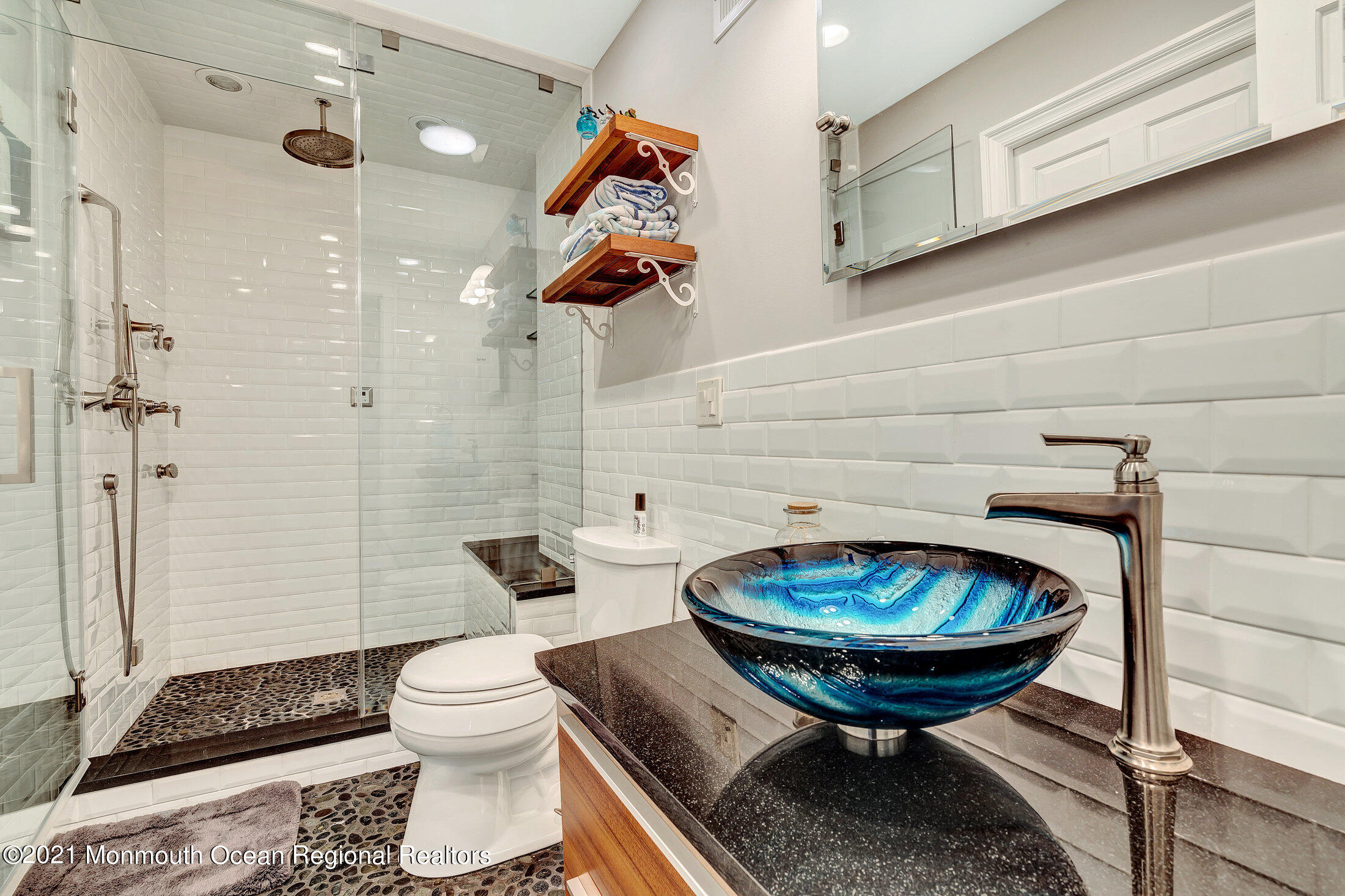 211 North Ocean Avenue Spring Lake, NJ 07762 - Photo 21 of 44 a bathroom with a sink a toilet and a mirror