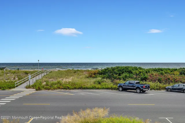 a view of a street with an ocean view