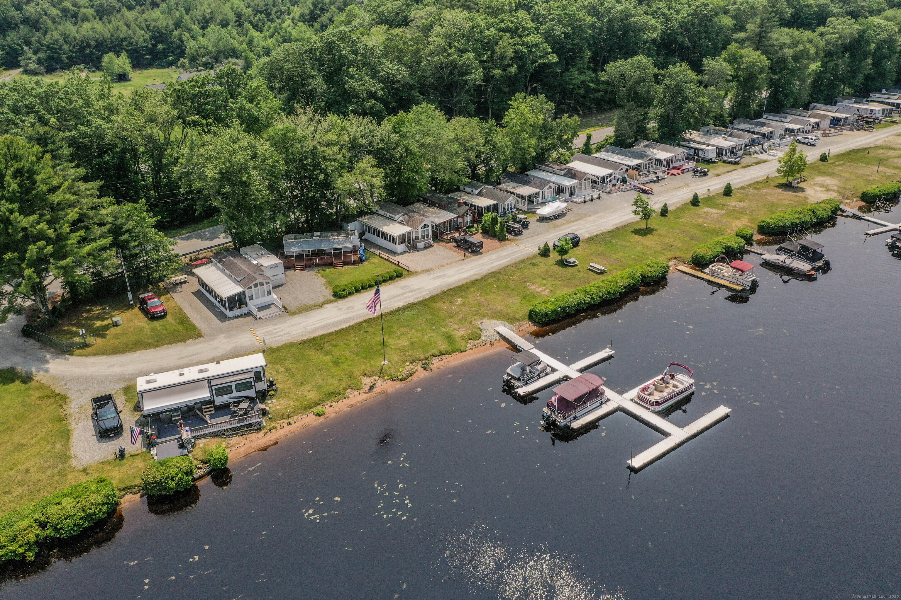 262 Shetucket Turnpike, Unit 2 Griswold, CT 06351 - Photo 20 of 26 an aerial view of a house with a yard basket ball court and outdoor seating