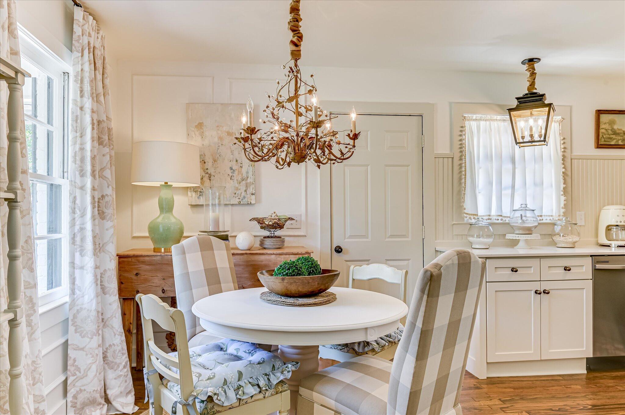 1121 Ridgecrest Avenue North Augusta, SC 29841 - Photo 12 of 42 a view of a dining room with furniture and a chandelier