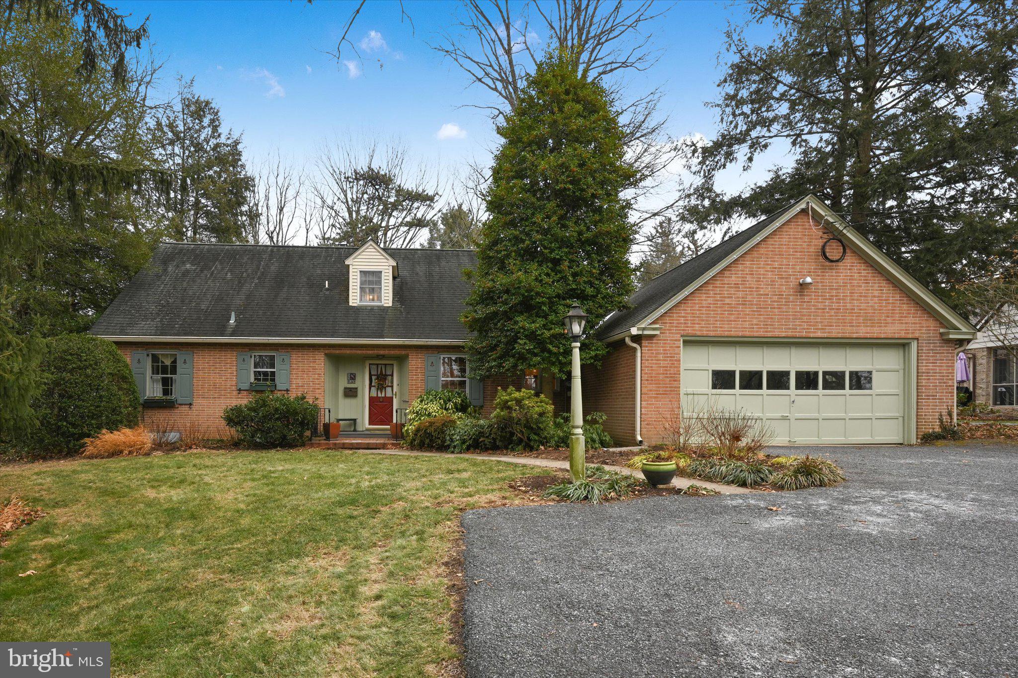 a view of house with yard