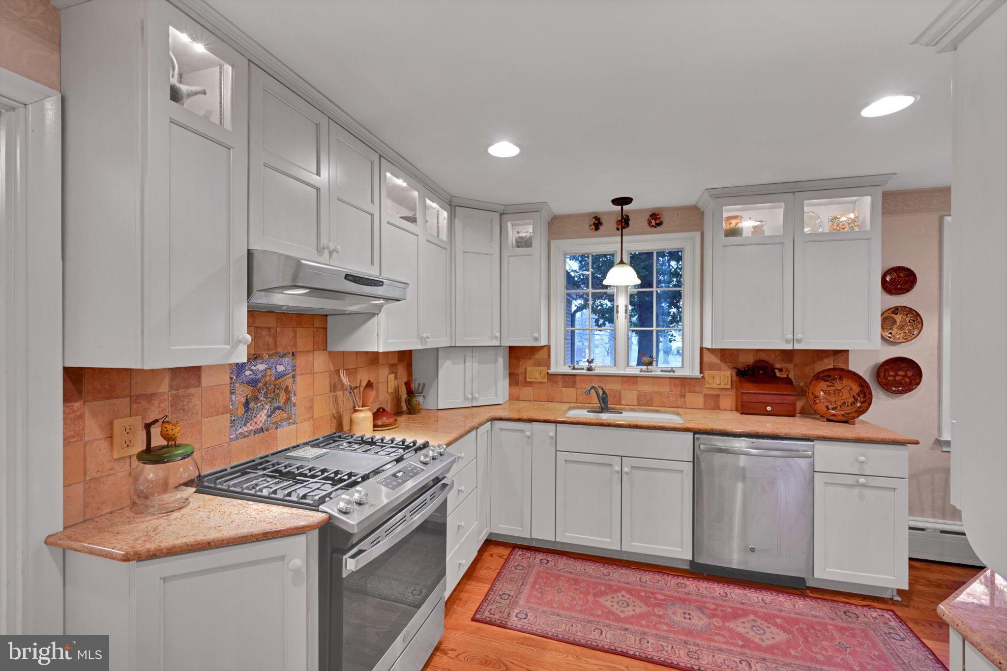 411 Woodcrest Avenue Lititz, PA 17543 - Photo 12 of 38 a kitchen with stainless steel appliances granite countertop a sink stove and cabinets
