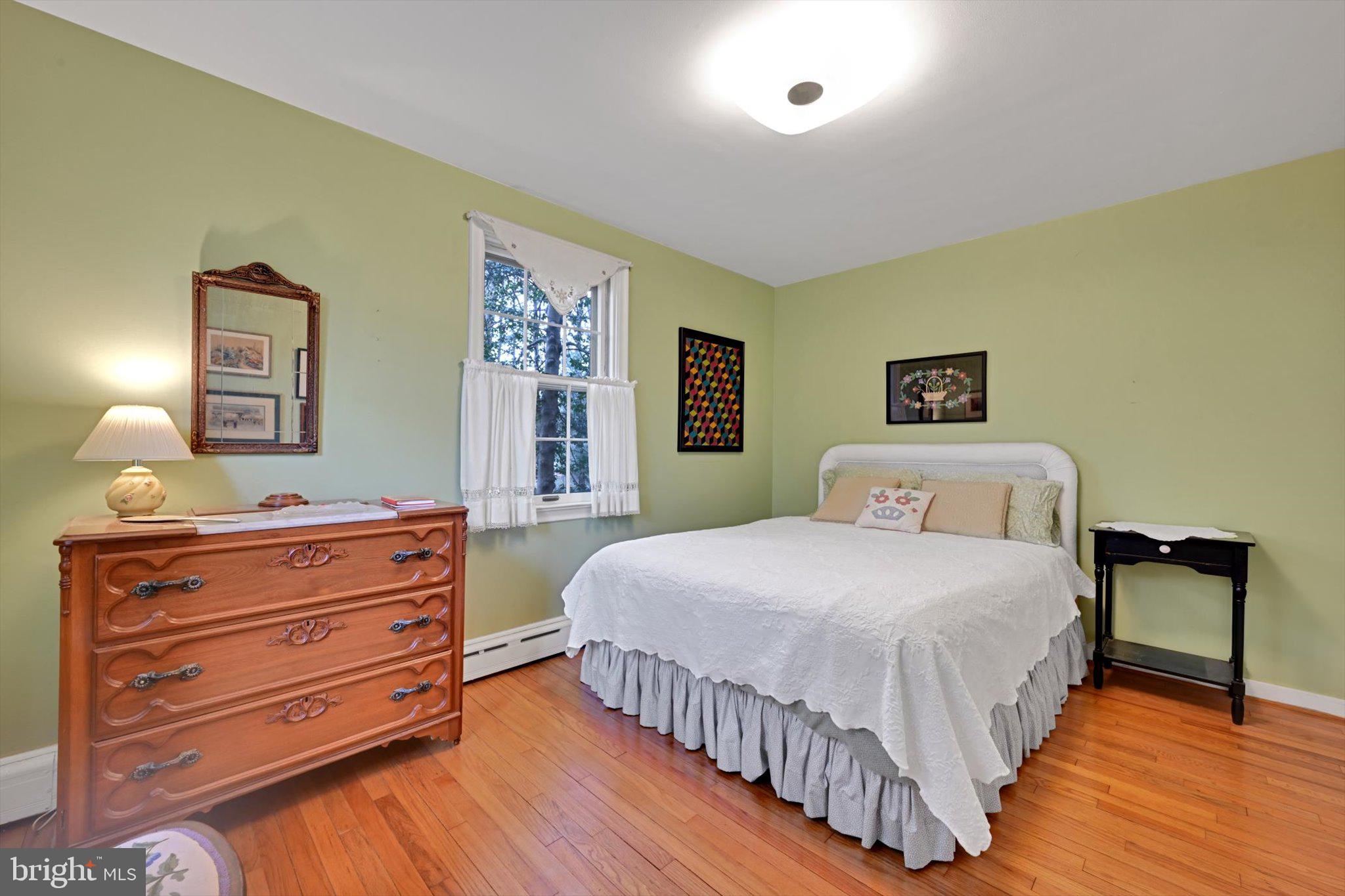 411 Woodcrest Avenue Lititz, PA 17543 - Photo 14 of 38 a bedroom with a bed and a dresser