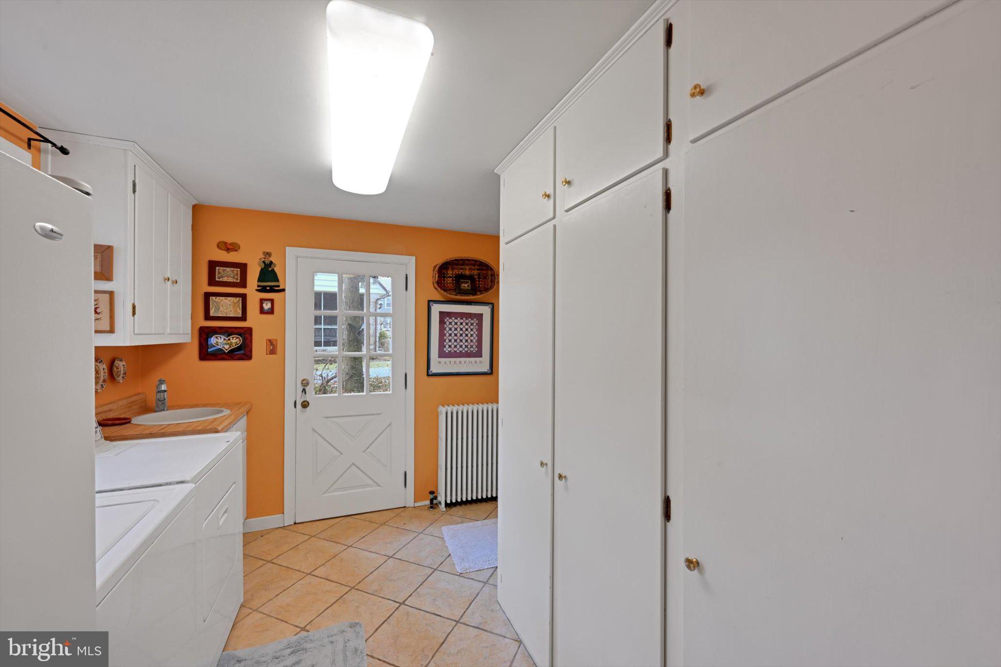 411 Woodcrest Avenue Lititz, PA 17543 - Photo 20 of 38 a view of a kitchen with a sink and dishwasher a refrigerator with white cabinets