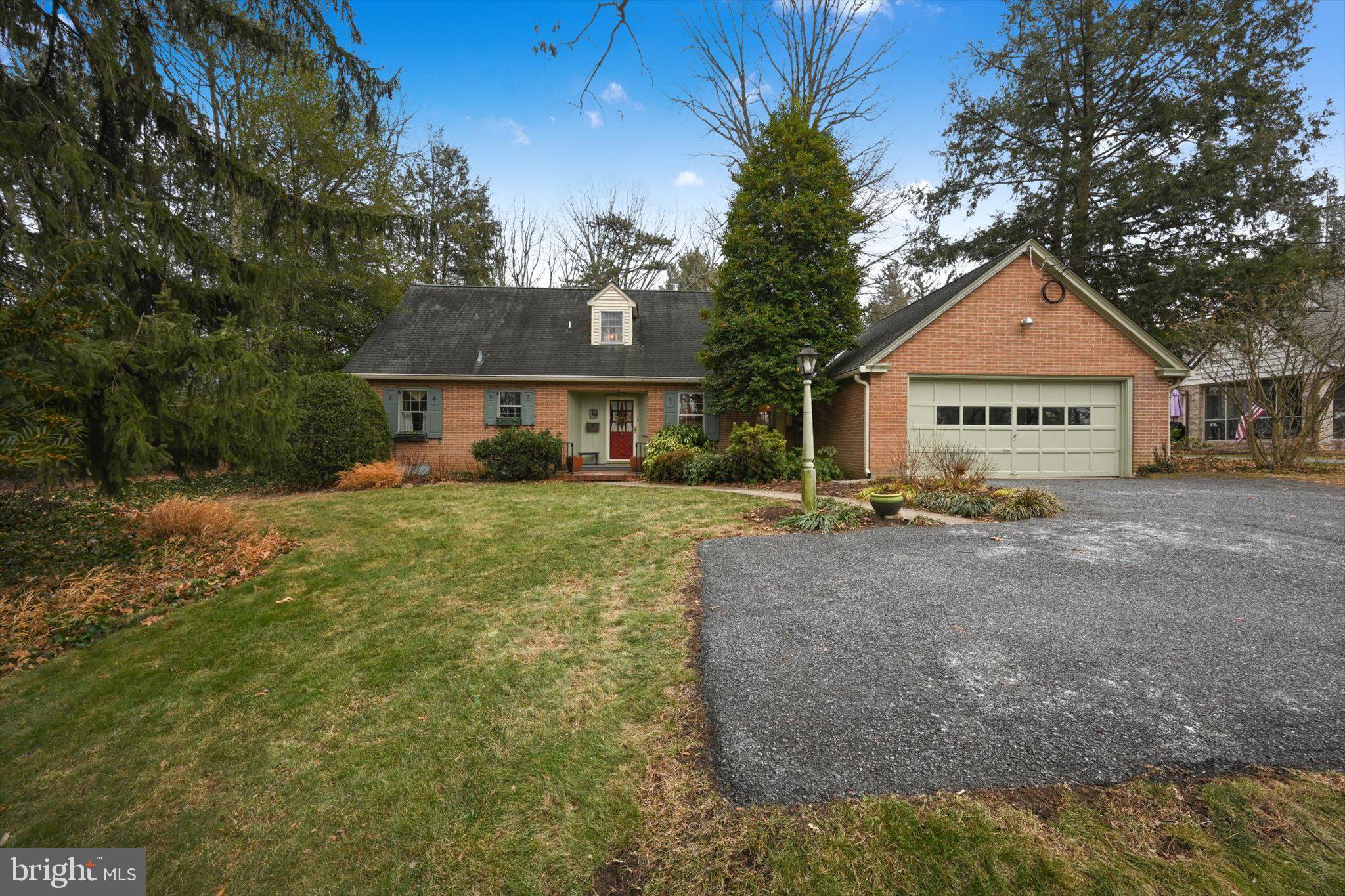 411 Woodcrest Avenue Lititz, PA 17543 - Photo 2 of 38 a front view of a house with garden