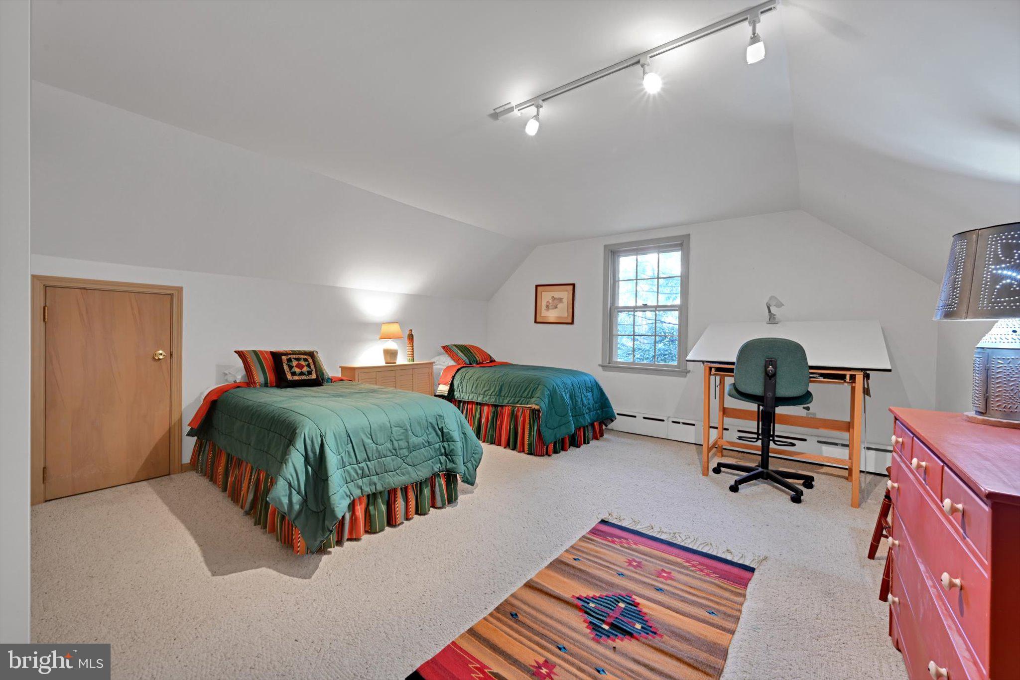 411 Woodcrest Avenue Lititz, PA 17543 - Photo 24 of 38 a bedroom with a bed and a chandelier