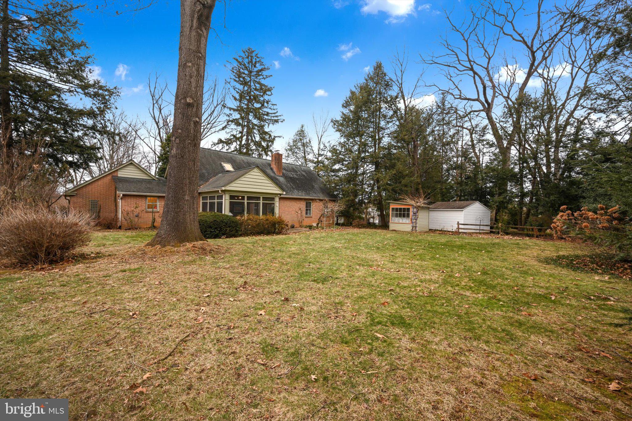411 Woodcrest Avenue Lititz, PA 17543 - Photo 35 of 38 a front view of a house with a yard and tree