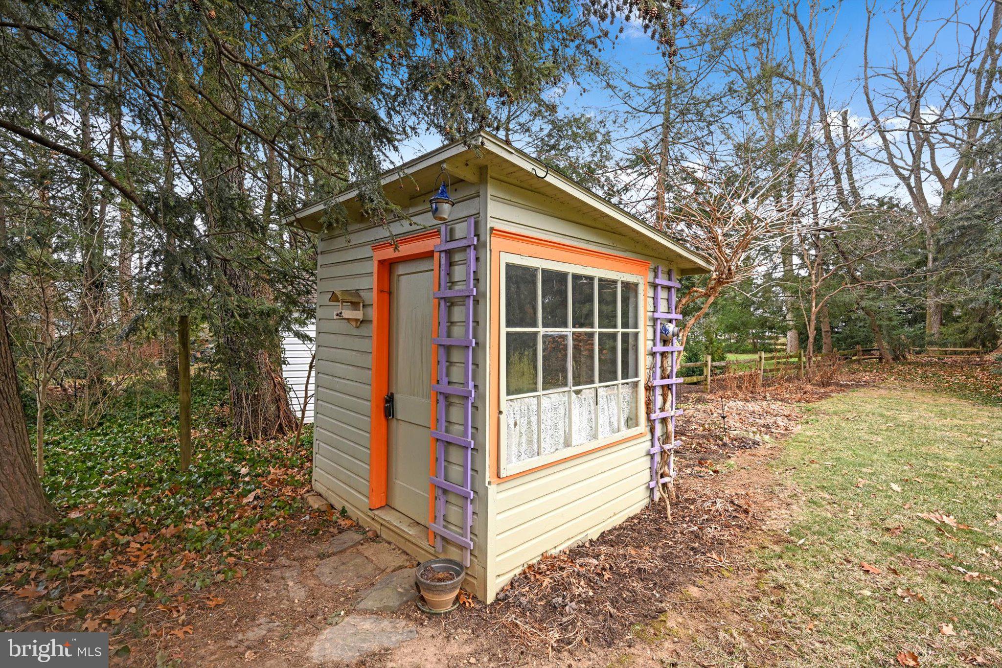 411 Woodcrest Avenue Lititz, PA 17543 - Photo 38 of 38 a view of backyard with large trees and wooden fence