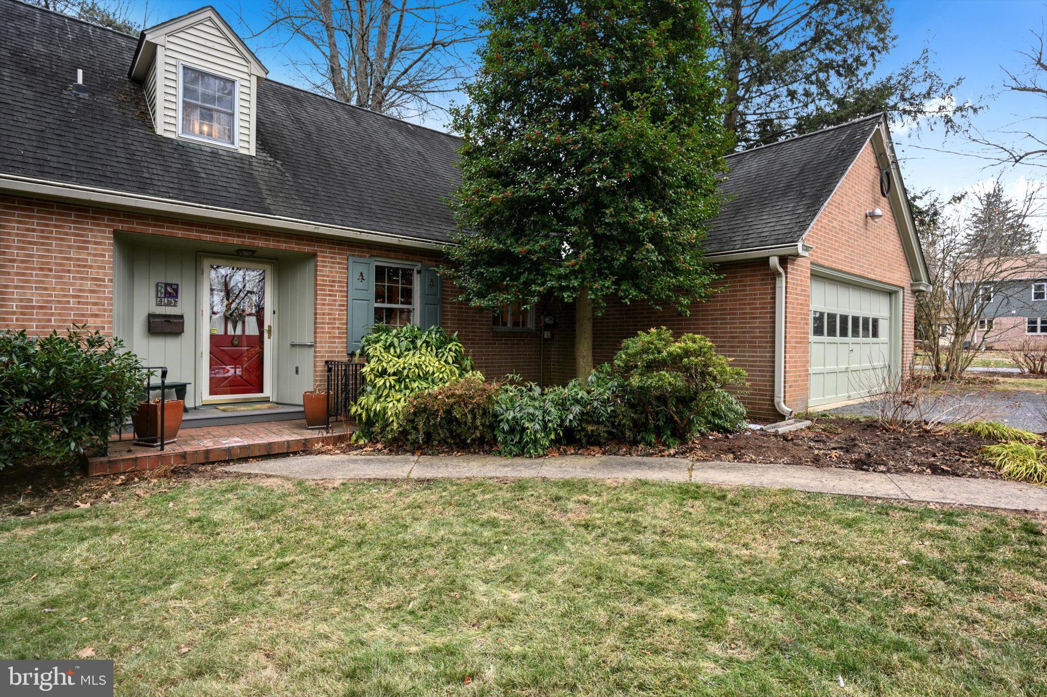 411 Woodcrest Avenue Lititz, PA 17543 - Photo 5 of 38 a view of a house with a yard and plants