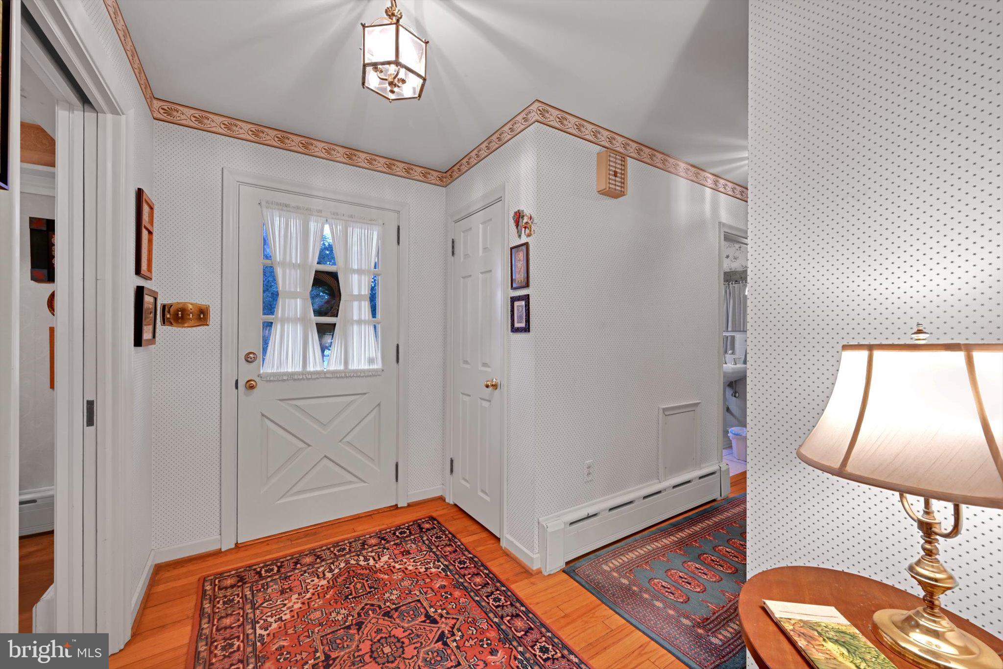 411 Woodcrest Avenue Lititz, PA 17543 - Photo 6 of 38 a very nice looking room with wooden floor and a large window