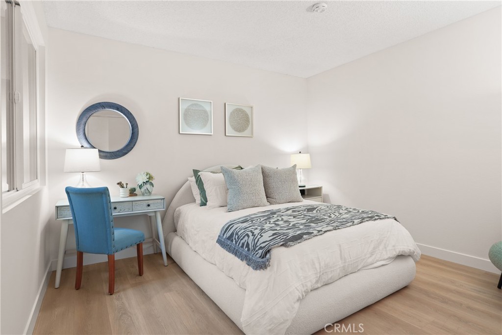 637 Avery Place Long Beach, CA 90807 - Photo 14 of 19 a bedroom with a bed and a table chair