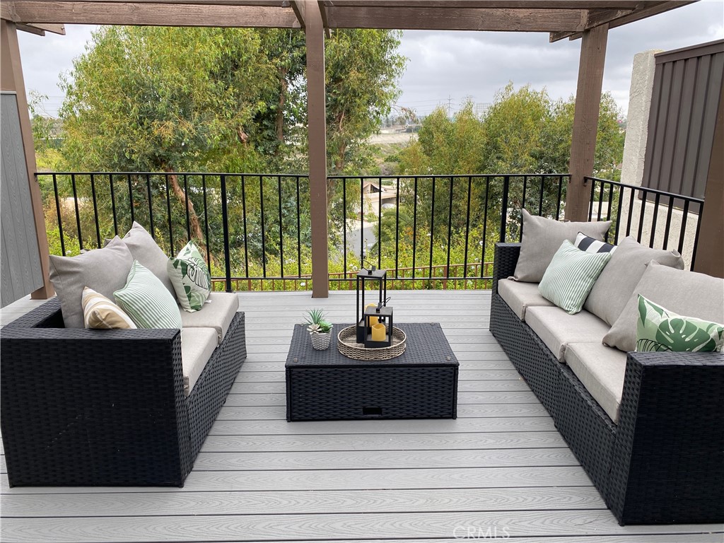 637 Avery Place Long Beach, CA 90807 - Photo 16 of 19 a balcony with furniture and wooden floor
