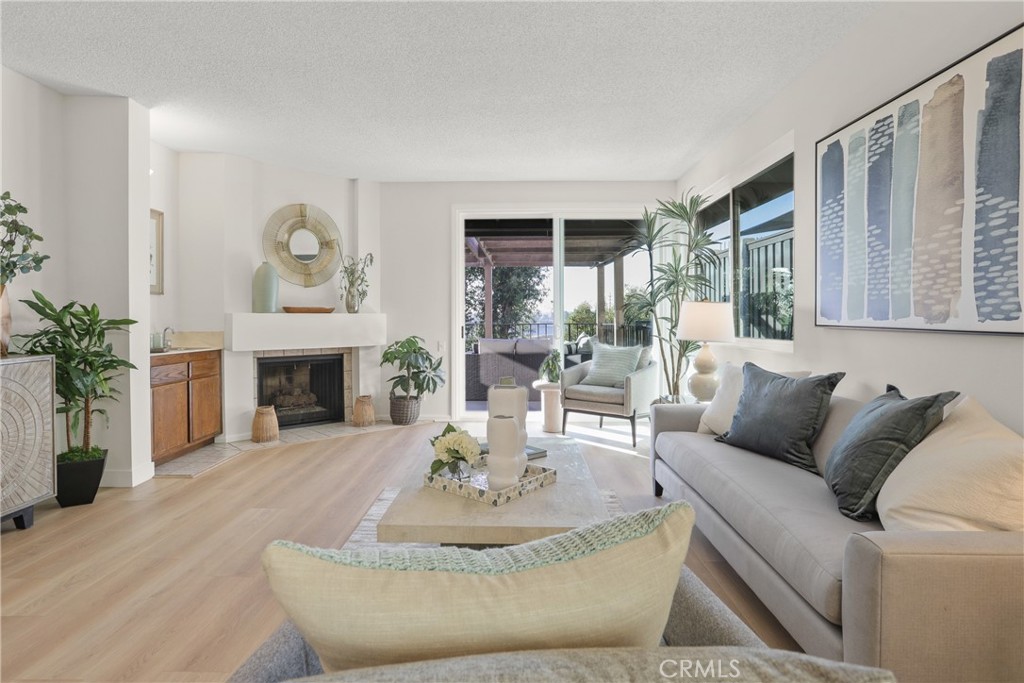 637 Avery Place Long Beach, CA 90807 - Photo 4 of 19 a living room with furniture and a fireplace