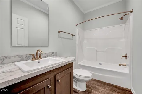 a bathroom with a sink a toilet and a bathtub