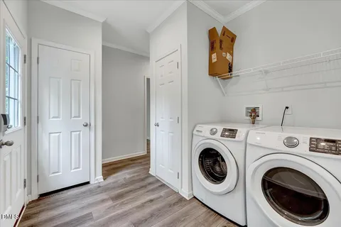 a view of kitchen and utility room with washer and dryer