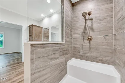 a bathroom with a bathtub and shower