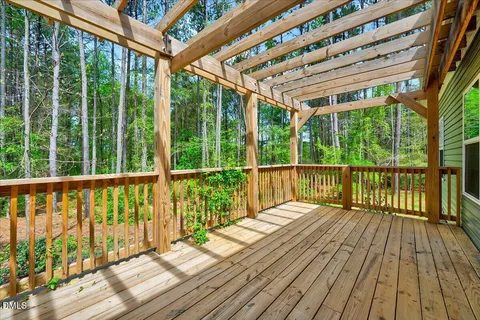a view of balcony with wooden floor