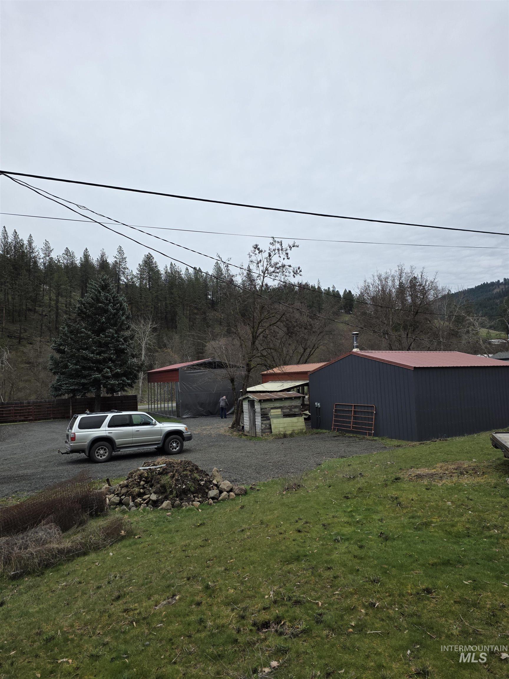 220 South Main Street Peck, ID 83545 - Photo 1 of 15 View of yard featuring an outdoor structure, a pole building, and driveway
