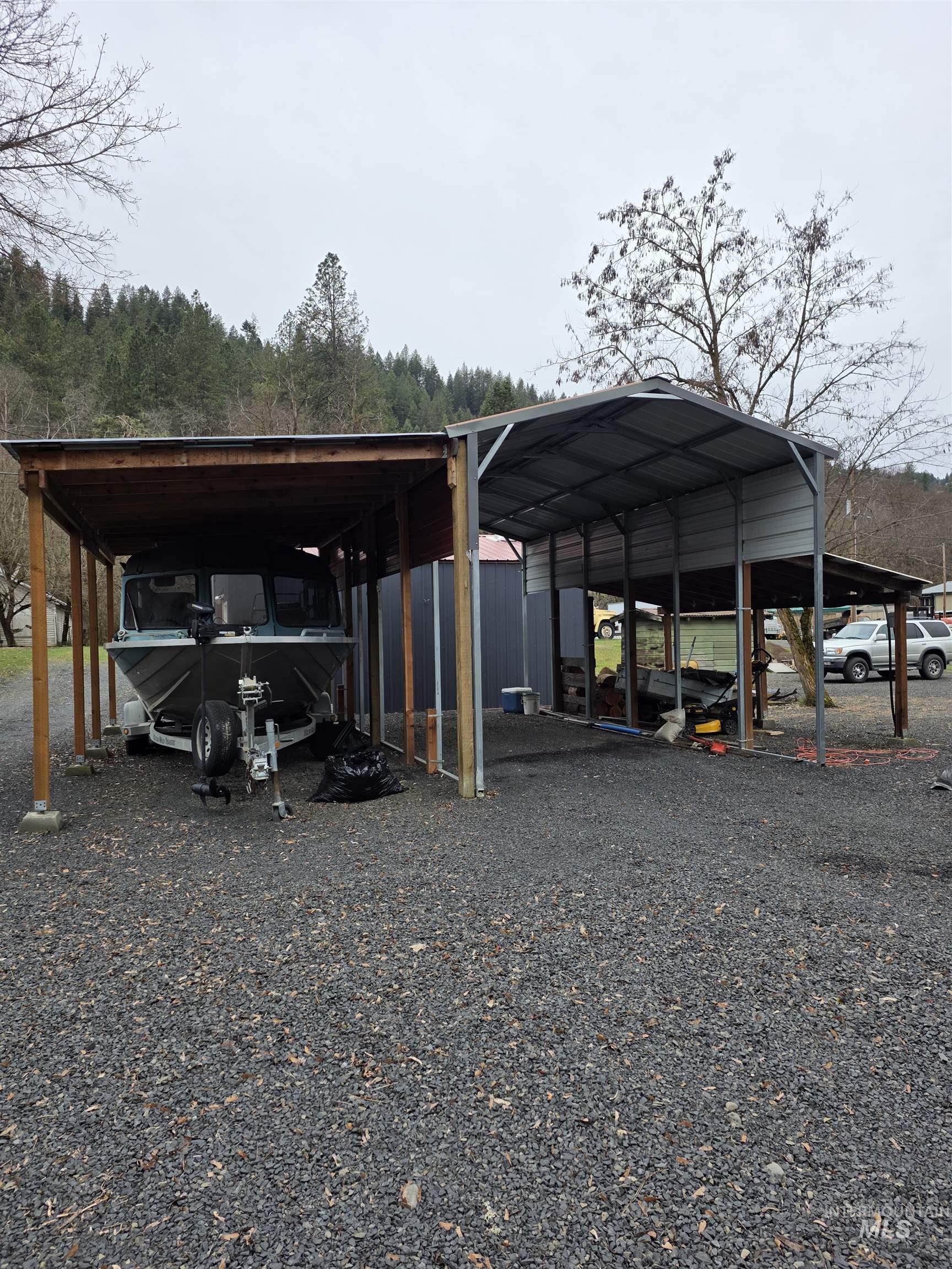 220 South Main Street Peck, ID 83545 - Photo 4 of 15 View of parking featuring a detached carport and driveway