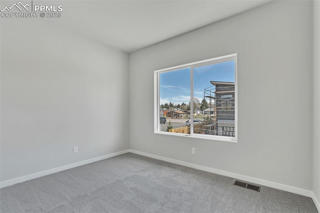 241 Front Street, Unit 103 Monument, CO 80132 - Photo 14 of 28 an empty room with windows