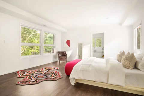 a bedroom with a bed and a table